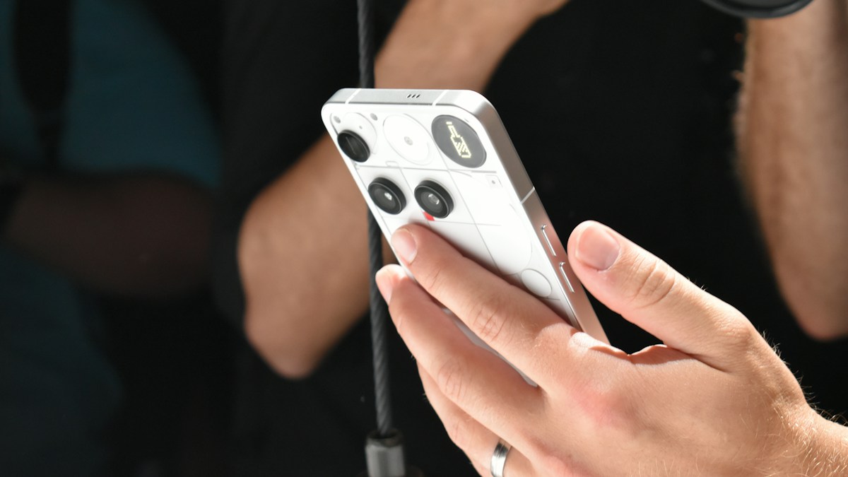 Person holding a white Android smartphone